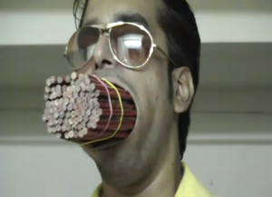 Dinesh with 92 pencils in his mouth